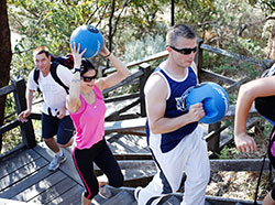 people hiking and carring training equipment